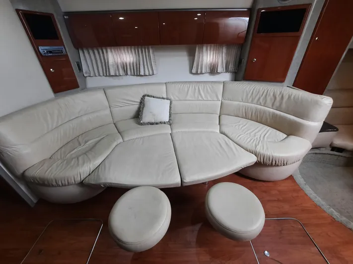 Paradox Yacht Photos Pics 2008 Formula 40 PC yacht interior with curved leather sofa and ottomans.