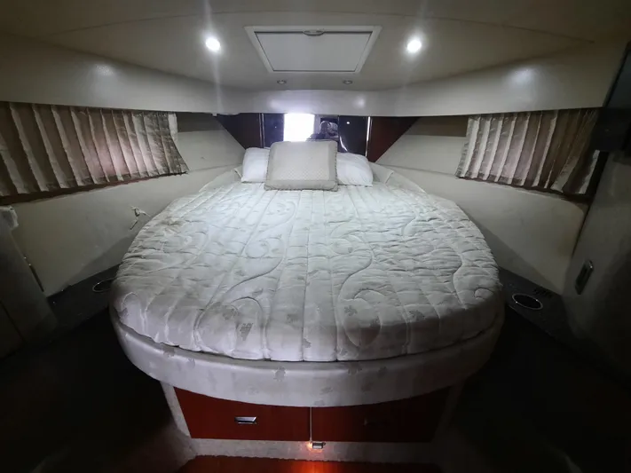 Paradox Yacht Photos Pics Luxurious 2008 Formula 40 PC yacht cabin with a spacious bed and ambient lighting.
