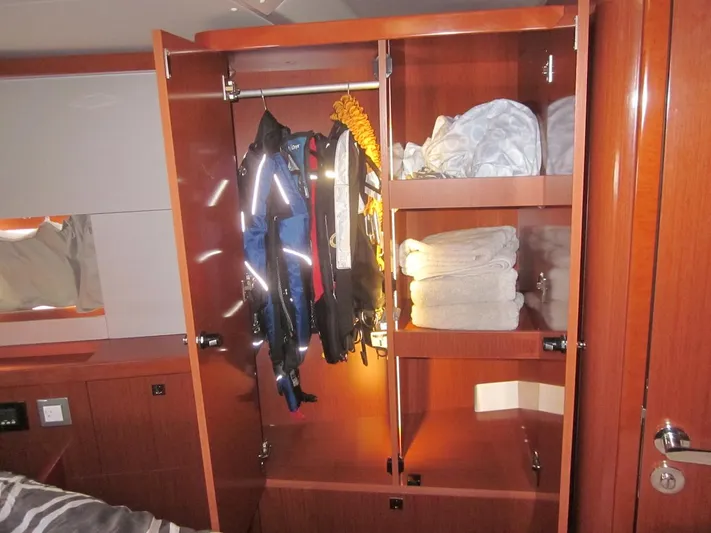 Cameli Yacht Photos Pics Wardrobe in 2020 Beneteau Oceanis 55 yacht with clothes and towels.