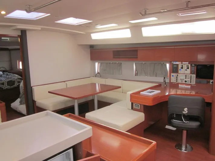Cameli Yacht Photos Pics Interior of 2020 Beneteau Oceanis 55 yacht with modern seating and navigation area.
