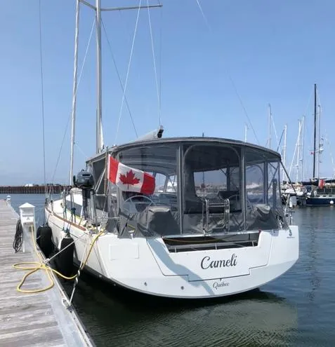 Cameli Yacht Photos Pics Beneteau Oceanis 55 sailboat docked, Canadian flag, 2020 model, marina setting.