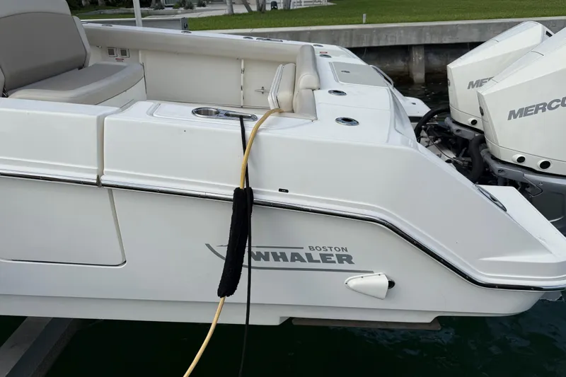 Yacht Photos Pics 2020 Boston Whaler 330 Outrage boat with dual Mercury engines docked.