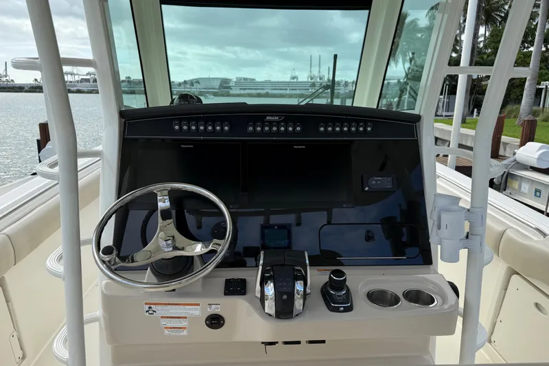  Yacht Photos Pics 2020 Boston Whaler 330 Outrage helm with modern controls and dual displays.