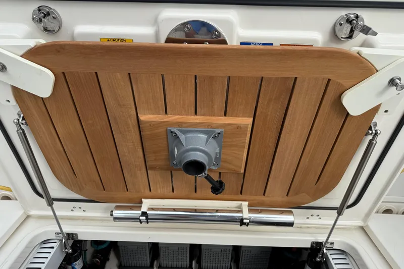 Yacht Photos Pics Boston Whaler 330 Outrage 2020, wooden hatch detail with metal fittings.