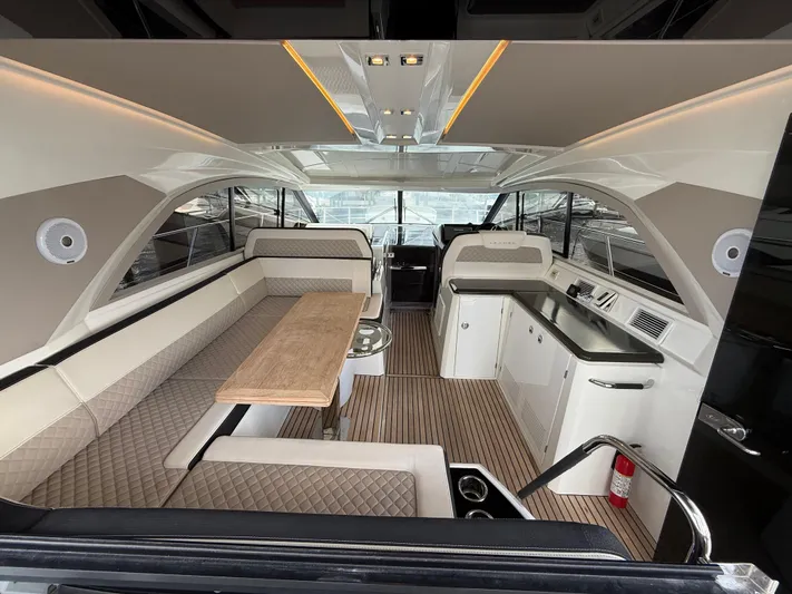 Luli Yacht Photos Pics 2017 Jeanneau Leader 46 yacht interior with elegant seating and modern kitchen.