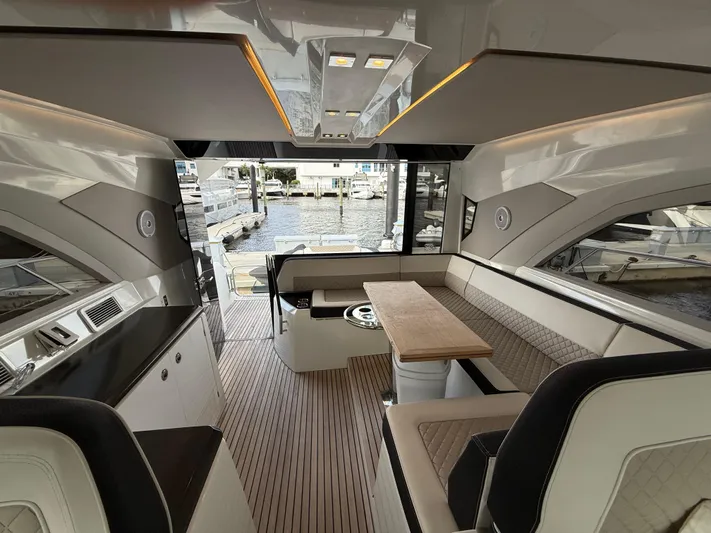 Luli Yacht Photos Pics Luxurious interior of 2017 Jeanneau Leader 46 yacht with elegant seating and wood flooring.