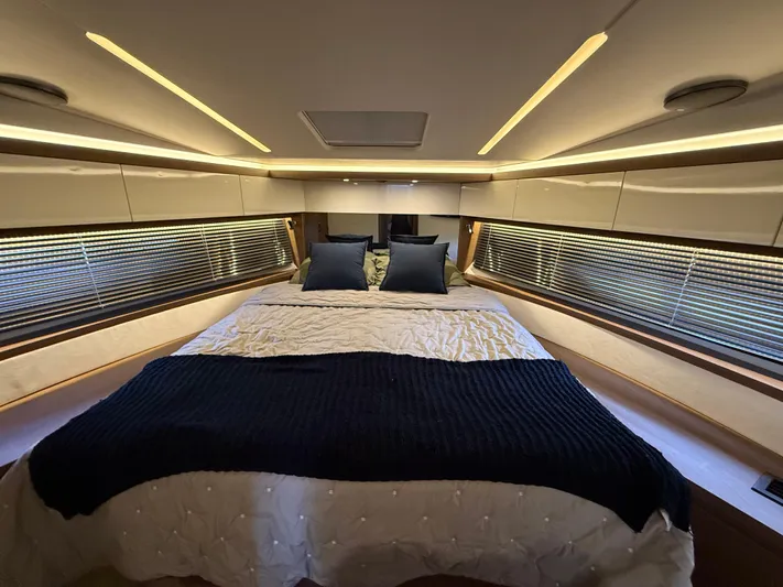 Luli Yacht Photos Pics Luxurious bedroom interior of 2017 Jeanneau Leader 46 yacht with modern design and ambient lighting.