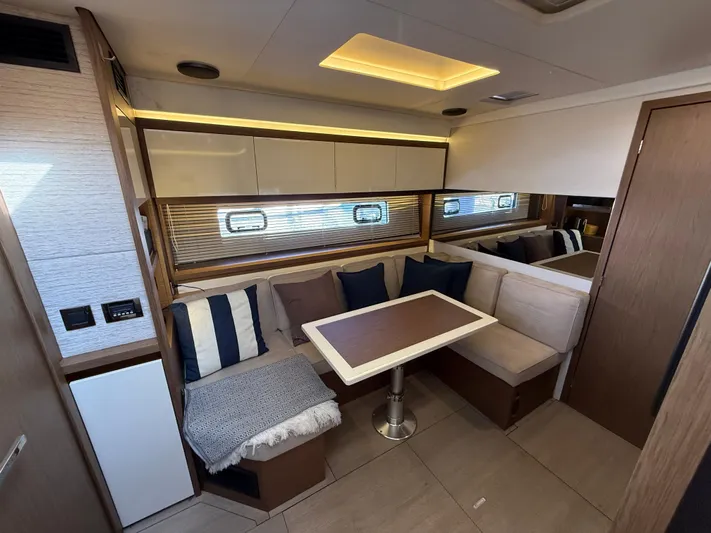 Luli Yacht Photos Pics Interior of 2017 Jeanneau Leader 46 yacht with cozy seating and modern design.