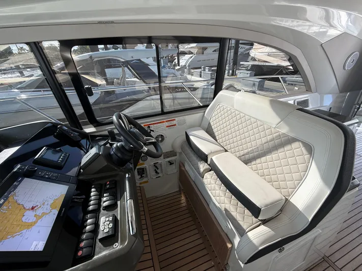Luli Yacht Photos Pics Interior of 2017 Jeanneau Leader 46 yacht with modern helm and seating.