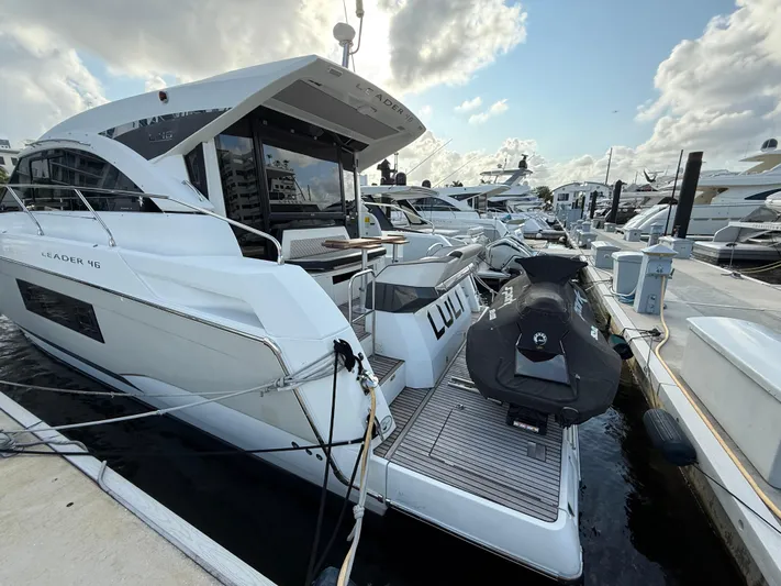 Luli Yacht Photos Pics 2017 Jeanneau Leader 46 yacht docked with jet ski on platform.