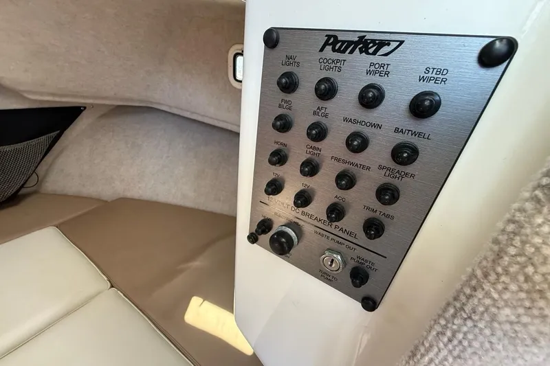  Yacht Photos Pics Control panel inside 2019 Parker 2520 XLD Sport Cabin boat, featuring various switches and labels.
