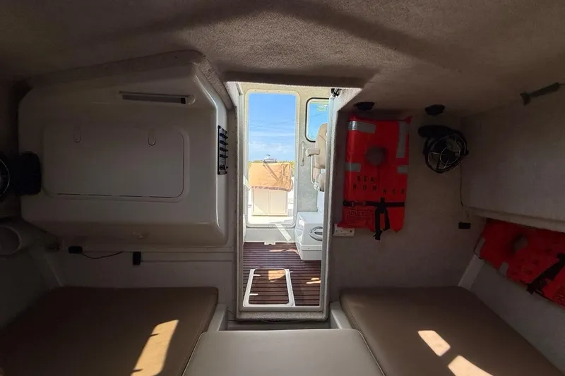  Yacht Photos Pics 2019 Parker 2520 XLD Sport Cabin interior with life jackets and seating.