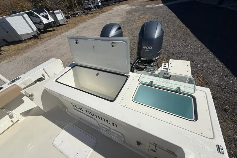  Yacht Photos Pics 2019 Parker 2520 XLD Sport Cabin boat with open storage compartments and dual outboard engines.
