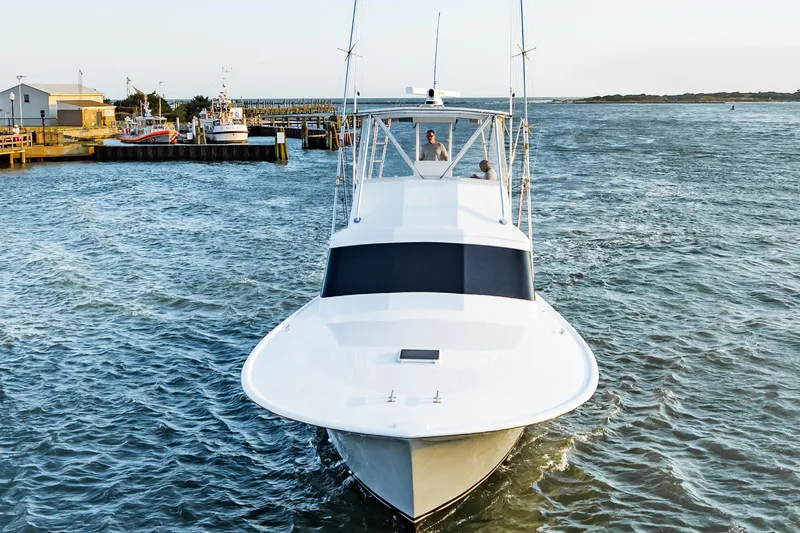 Leslie Ann Yacht Photos Pics 1988 Buddy Davis 47 Convertible yacht navigating a coastal waterway.