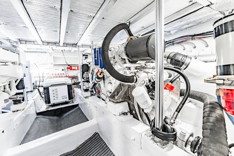 Leslie Ann Yacht Photos Pics Engine room of 1988 Buddy Davis 47 Convertible yacht, showcasing mechanical components.