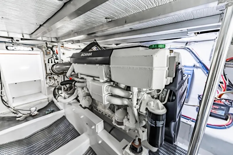 Leslie Ann Yacht Photos Pics Engine room of 1988 Buddy Davis 47 Convertible with Scania engine, showcasing mechanical details.