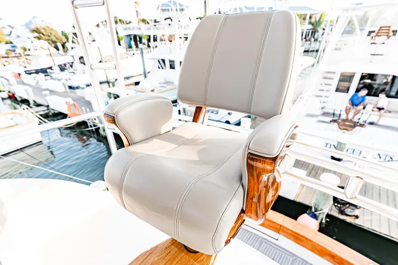 Leslie Ann Yacht Photos Pics Captain's chair on 1988 Buddy Davis 47 Convertible yacht, docked at marina.