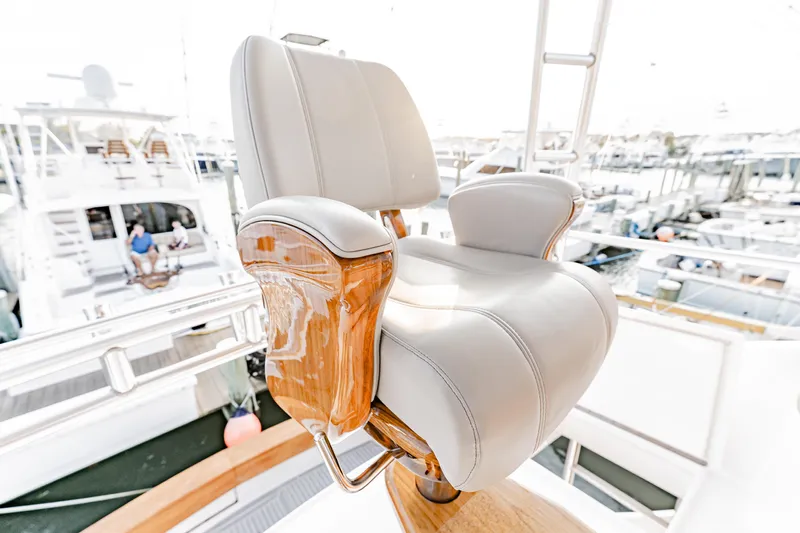Leslie Ann Yacht Photos Pics Captain's chair on 1988 Buddy Davis 47 Convertible yacht, docked at marina.