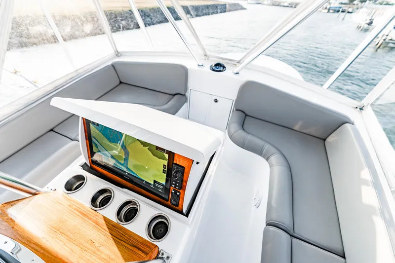 Leslie Ann Yacht Photos Pics 1988 Buddy Davis 47 Convertible yacht interior with navigation system and seating area.