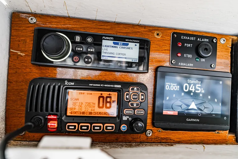 Leslie Ann Yacht Photos Pics Control panel of a 1988 Buddy Davis 47 Convertible boat with navigation and communication devices.