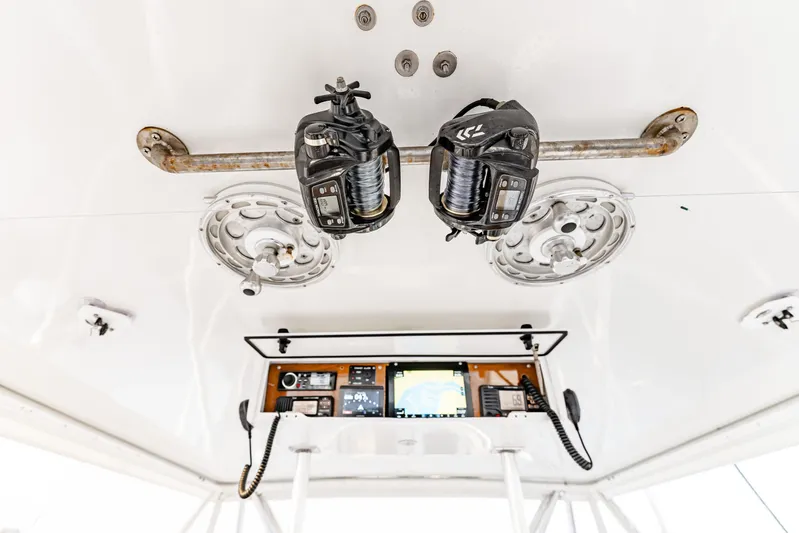 Leslie Ann Yacht Photos Pics Ceiling view of 1988 Buddy Davis 47 Convertible boat with fishing reels and navigation equipment.