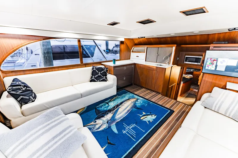 Leslie Ann Yacht Photos Pics Luxurious interior of 1988 Buddy Davis 47 Convertible yacht with elegant seating and marine-themed decor.