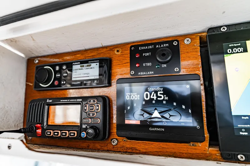 Leslie Ann Yacht Photos Pics Control panel of a 1988 Buddy Davis 47 Convertible boat with navigation and alarm systems.