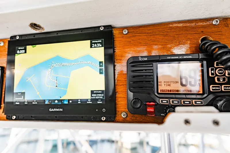 Leslie Ann Yacht Photos Pics Garmin navigation and Icom VHF radio on 1988 Buddy Davis 47 Convertible boat.