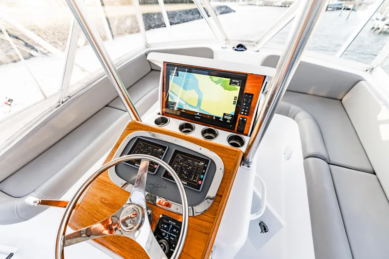 Leslie Ann Yacht Photos Pics 1988 Buddy Davis 47 Convertible helm with navigation system and steering wheel.