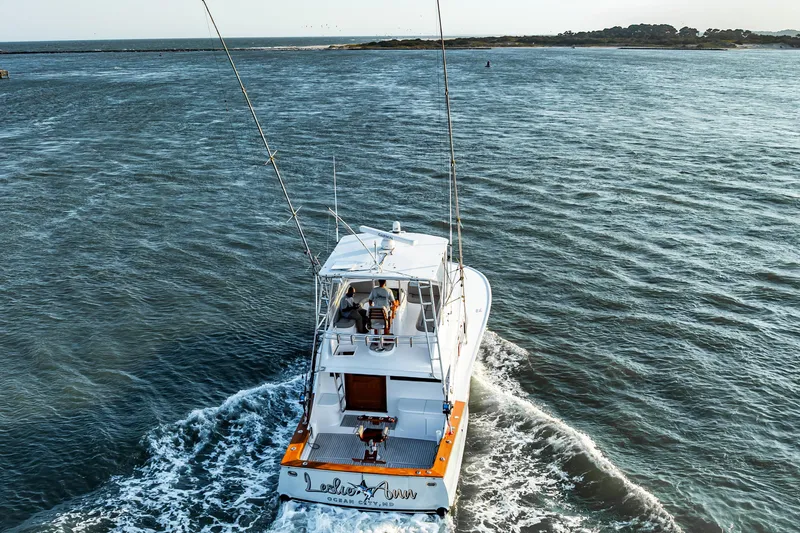 Leslie Ann Yacht Photos Pics 1988 Buddy Davis 47 Convertible yacht cruising on open water.