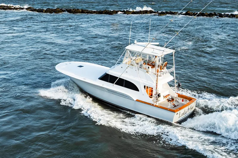 Leslie Ann Yacht Photos Pics 1988 Buddy Davis 47 Convertible yacht cruising on open water.