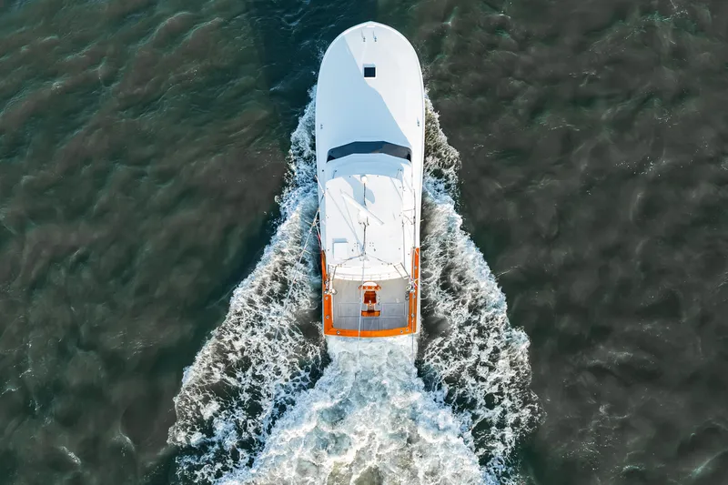 Leslie Ann Yacht Photos Pics Aerial view of 1988 Buddy Davis 47 Convertible yacht cruising through water.