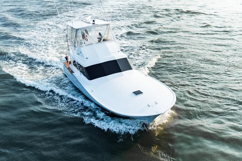 Leslie Ann Yacht Photos Pics 1988 Buddy Davis 47 Convertible yacht cruising on open water.