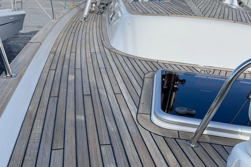 Friheten Yacht Photos Pics Teak deck of 2009 Hallberg-Rassy 54 yacht, showcasing sleek design and craftsmanship.