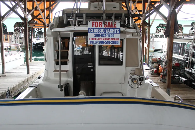  Yacht Photos Pics 2016 Cutwater 30 Command Bridge yacht for sale at marina dock.