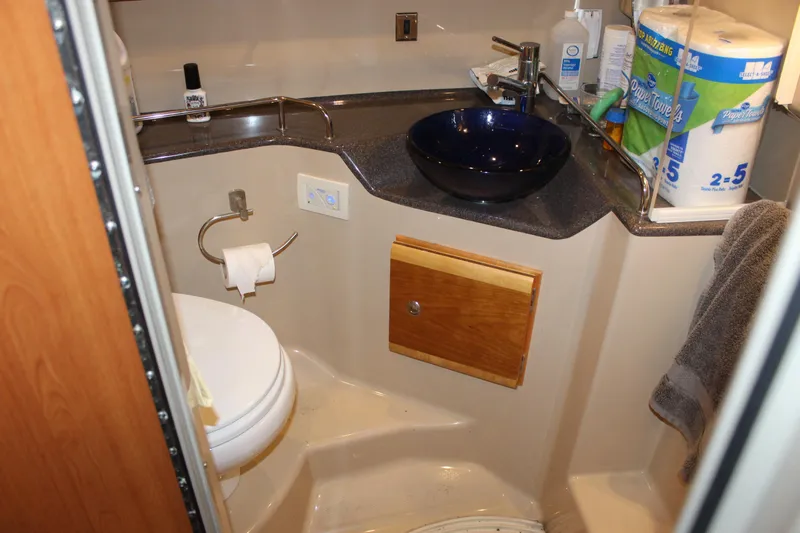  Yacht Photos Pics Compact bathroom in 2016 Cutwater 30 Command Bridge with modern sink and toilet.