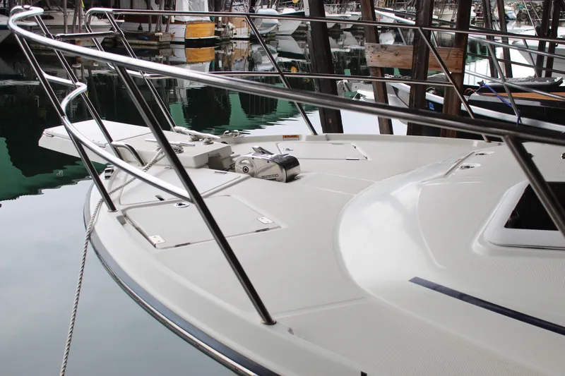  Yacht Photos Pics 2016 Cutwater 30 Command Bridge boat docked, showcasing sleek deck and railing design.