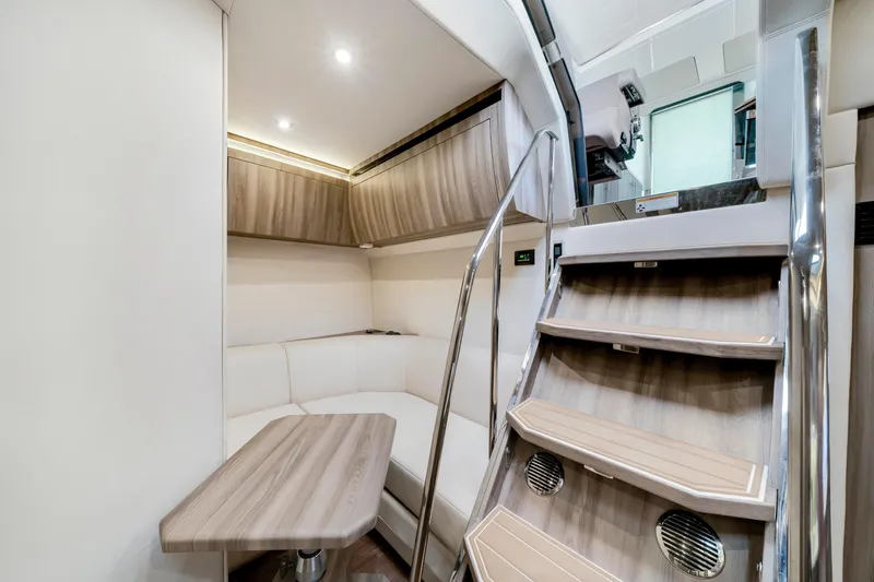 Life Is Good Yacht Photos Pics Luxurious interior of 2017 Regal 53 Sport Coupe with modern seating and wooden accents.