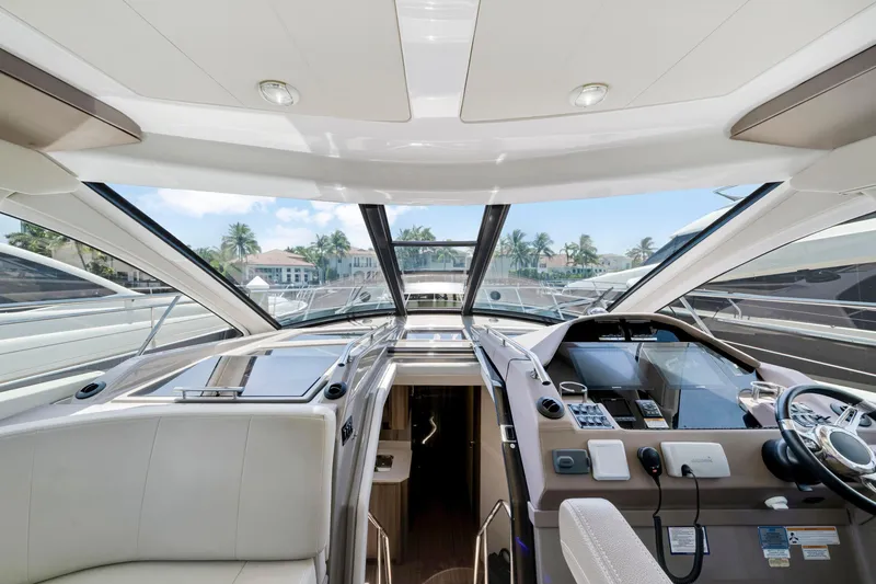 Life Is Good Yacht Photos Pics Interior view of 2017 Regal 53 Sport Coupe yacht cockpit with modern controls and seating.