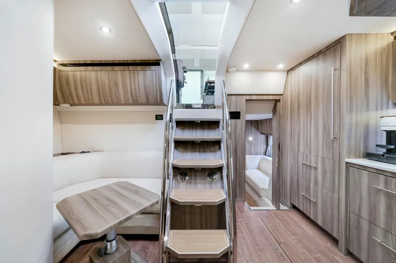 Life Is Good Yacht Photos Pics Luxurious interior of 2017 Regal 53 Sport Coupe yacht with modern wood finishes.