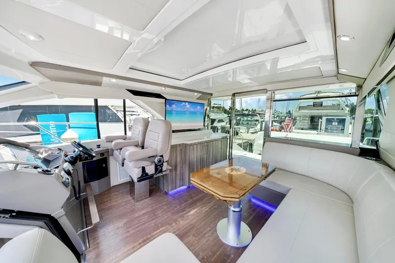 Life Is Good Yacht Photos Pics Luxurious interior of 2017 Regal 53 Sport Coupe yacht with modern seating and helm.