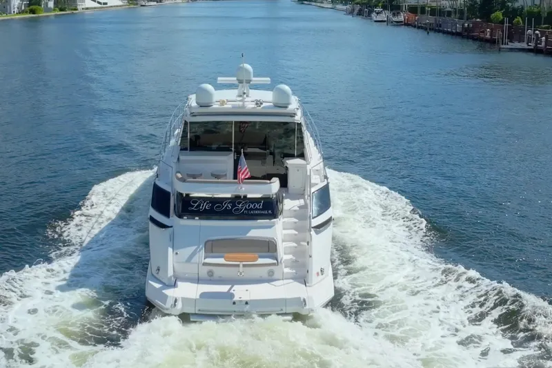 Life Is Good Yacht Photos Pics 2017 Regal 53 Sport Coupe yacht cruising on a scenic waterway.