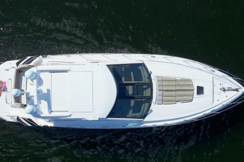 Life Is Good Yacht Photos Pics Aerial view of 2017 Regal 53 Sport Coupe yacht cruising on water.