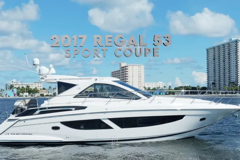 Life Is Good Yacht Photos Pics 2017 Regal 53 Sport Coupe yacht on water with cityscape background.