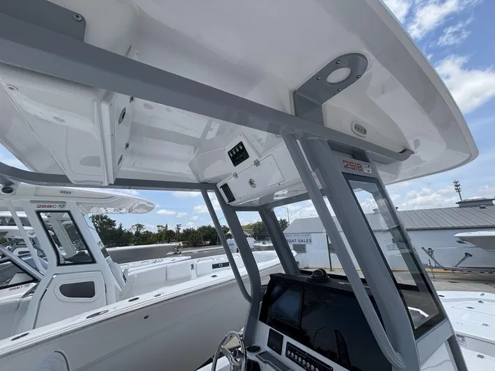  Yacht Photos Pics 2025 Sea Fox 251 Bay Fox boat interior with modern console and overhead storage.
