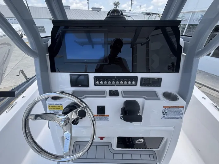  Yacht Photos Pics 2025 Sea Fox 251 Bay Fox boat dashboard with steering wheel and control panel.