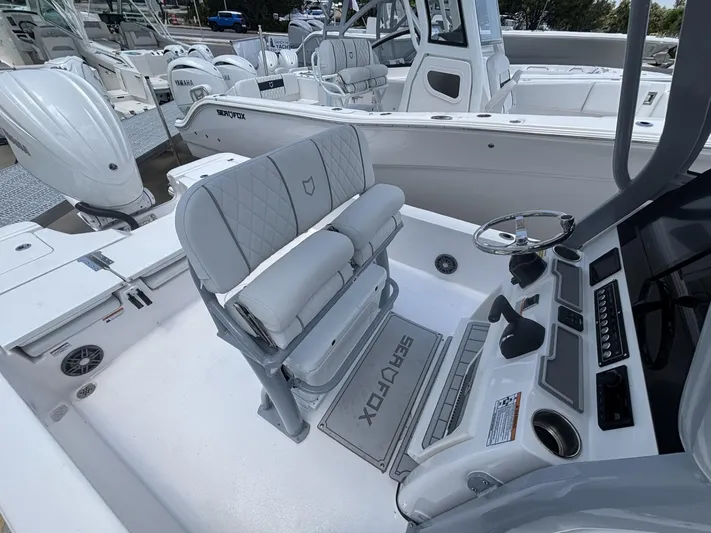  Yacht Photos Pics 2025 Sea Fox 251 Bay Fox boat interior with modern seating and control panel.