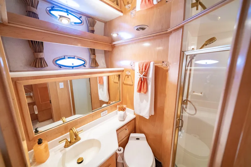 Altitude Adjustment Yacht Photos Pics Luxurious bathroom in 2000 Navigator 5300 Classic yacht with elegant fixtures and shower.