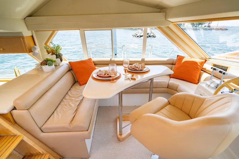 Altitude Adjustment Yacht Photos Pics Luxurious interior of 2000 Navigator 5300 Classic yacht with elegant seating and dining area.