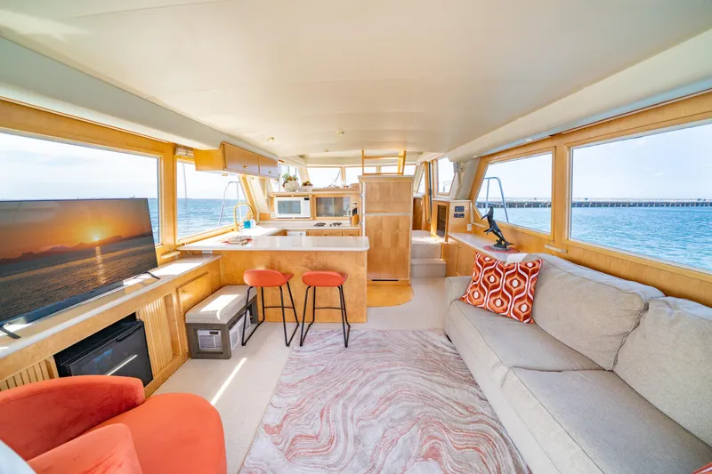 Altitude Adjustment Yacht Photos Pics Luxurious interior of 2000 Navigator 5300 Classic yacht with modern amenities and ocean view.